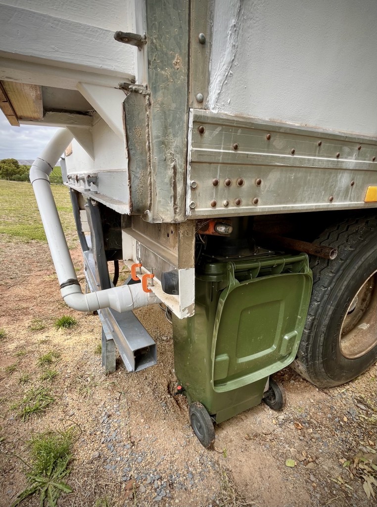 the outdoor set-up of the composting wheelie bin and exhaust system